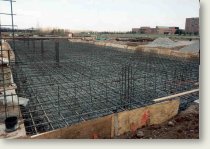 Counterfort earth retaining structures and concrete mat foundations