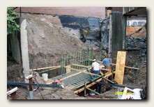 New retaining wall foundation and steel